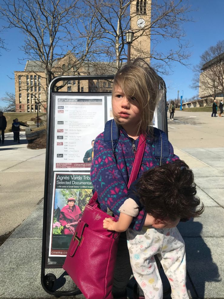 Picture of Lucy standing in front of sign