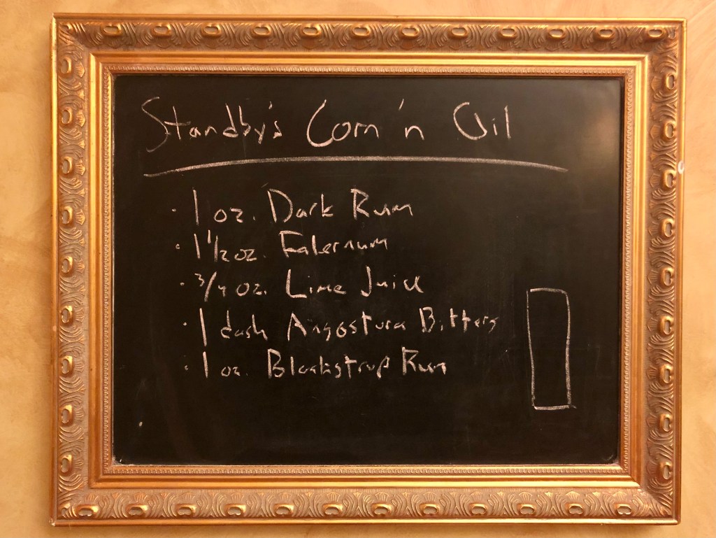 Chalkboard with a cocktail recipe on it