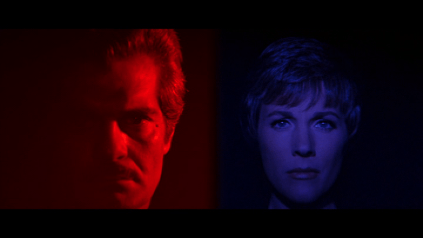 Screengrab from the Tamarind Seed showing Omar Sharif's face tinted red and Julie Andrews's face tinted blue