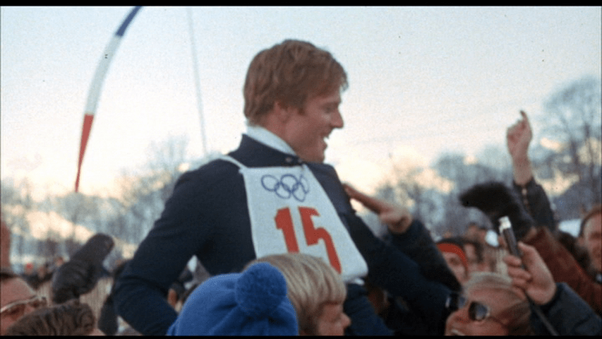 Screengrab from Downhill Racer showing Dave Chappellet being hoisted upon the crowd's shoulders after his gold medal victory.