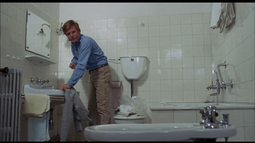 Screengrab from Downhill Racer showing Robert Redford's character contemplating a bidet.