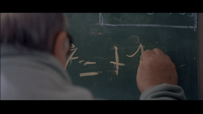 Screengrab from A Christmas Tale showing Abel doing math on a chalkboard