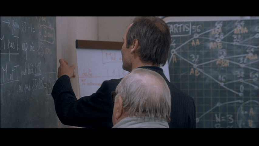 Screengrab from A Christmas Tale showing Claude tapping on the chalkboard