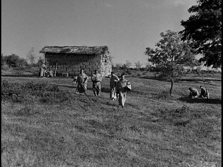 Screengrab from The Flowers of St. Francis showing monks running toward the camear