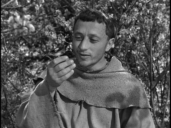 Screengrab from The Flowers of St. Francis showing Francis talking to a bird