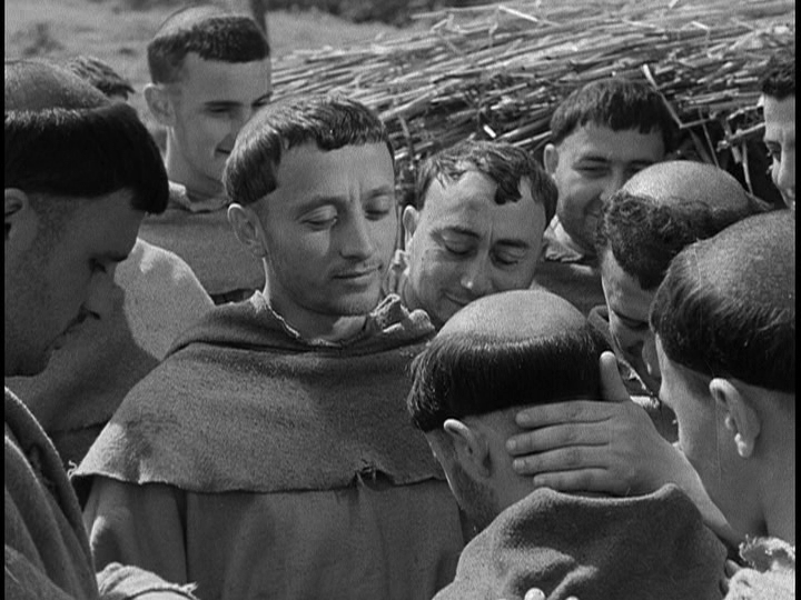 Screengrab from The Flowers of St. Francis showing Francis smiling at Brother Ginepro