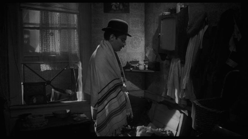 Screengrab from Hester Street showing Jake praying