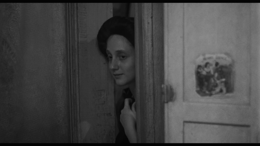 Screengrab from Hester Street showing Gitl watching Bernstein teaching her son how to read