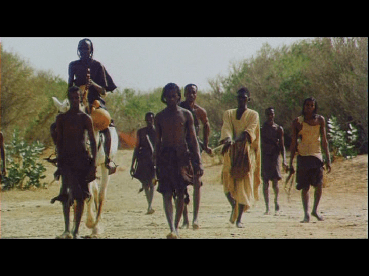 Screengrab from Yeelen showing Nianankoro being led somewhere by the men who have captured him as a suspected cattle thief