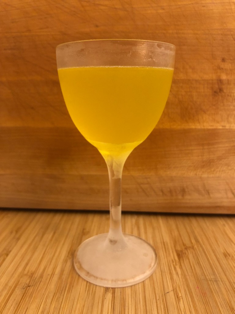 Yellow Cocktail in a coupe glass