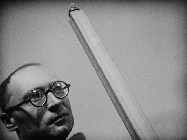 Shot of a priest wearing glasses which had not yet been invented when Joan of Arc was alive