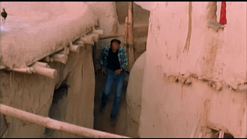 Behzad ducking down an alleyway