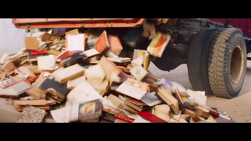 Books being dumped out of a truck