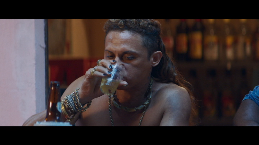 Lunga drinking from a glass similar to the one we serve Rio Bravos (and red wine) in