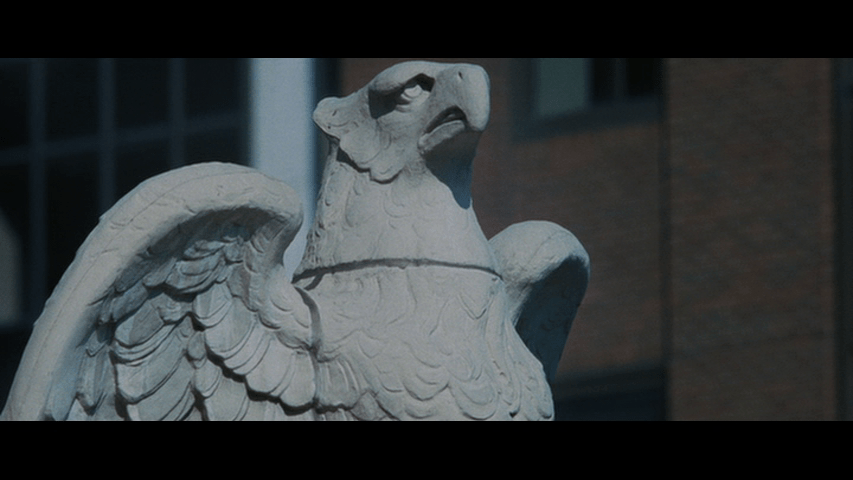 Close up of a gargoyle adorning the Manhattan Trust Bank