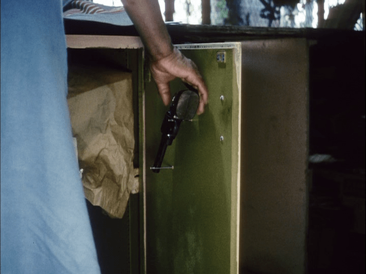 Pierce's mother and the gun she keeps behind the counter of her dry cleaners