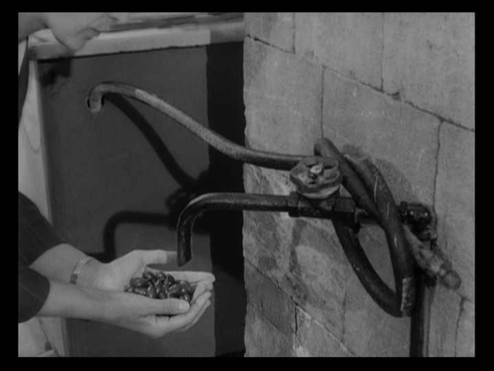 Petrukhina holding her cherries underneath a faucet
