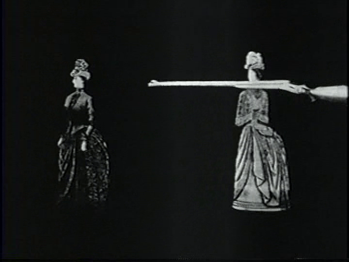 Two Victorian ladies pursue the watermelon thief with a shotgun