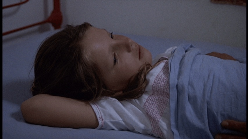 Medium shot of Grace describing the dream she just woke up from