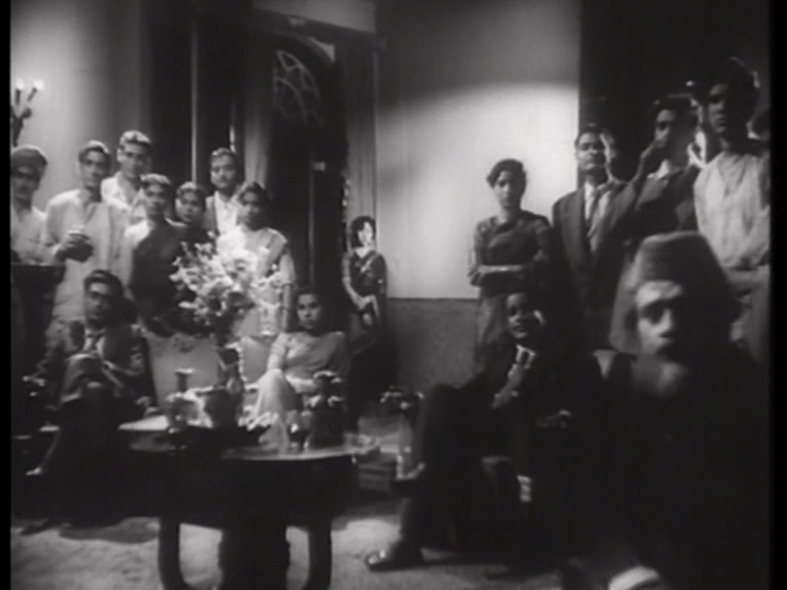 Meena from a distance at the beginning of a tracking shot