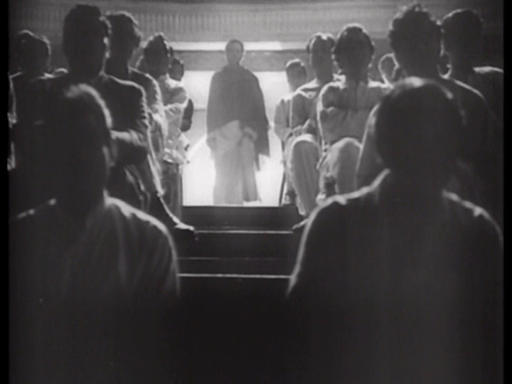 Vijay appears in a backlit doorway