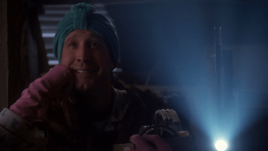 Another medium shot of Clark watching home movies