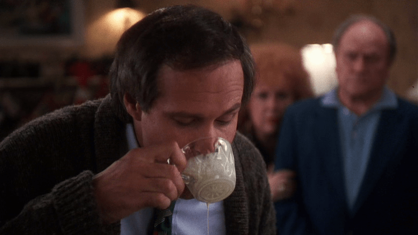 Close-up of Clark guzzling eggnog