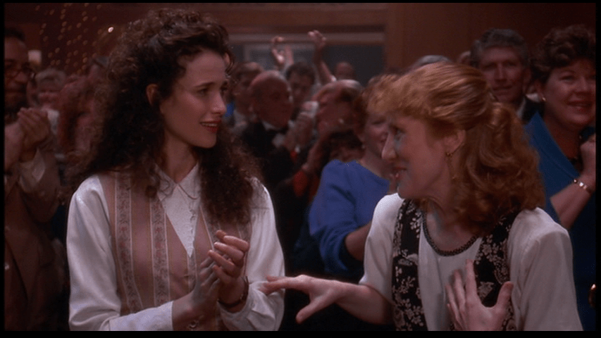 "I'm his teacher," the woman standing next to Rita tells her