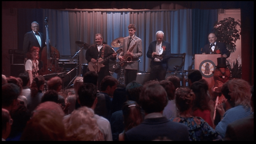 Buster announces that a bachelor auction is about to begin