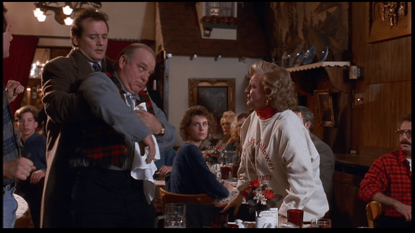 Phil give the Heimlich maneuver to Buster