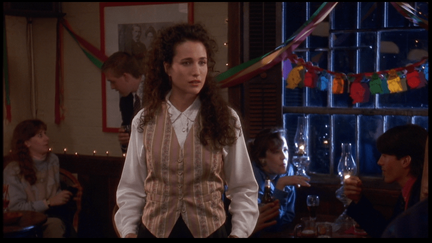 Medium shot of Rita looking puzzled