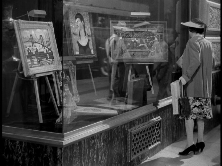 Shot of an art gallery window display which utilizes rear projection to good effect