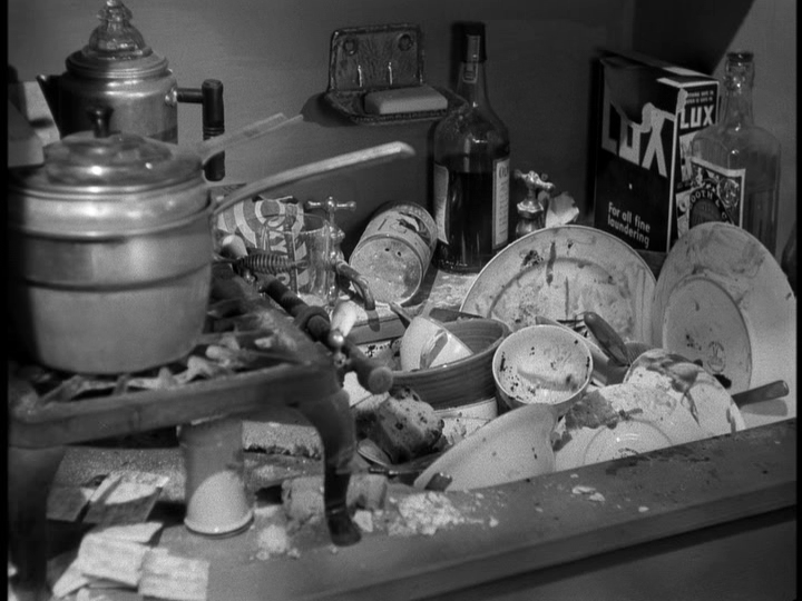 Close-up of a sink full of dirty dishes