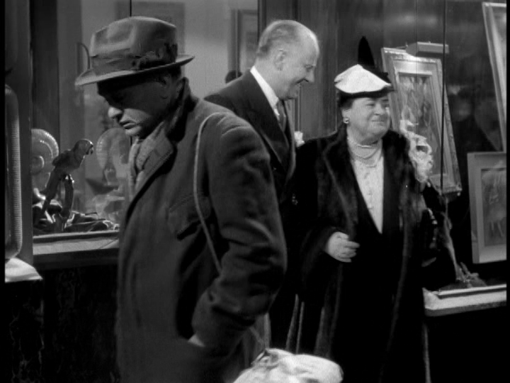 Chris shuffles past a long shot of Dellarowe and a customer