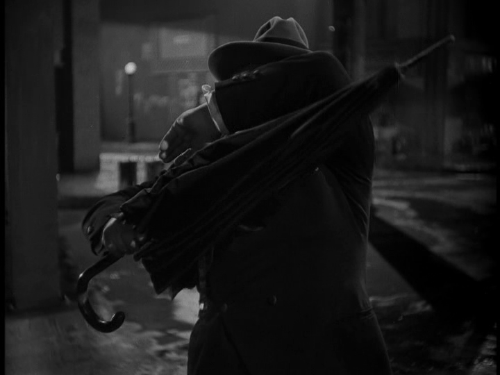 Chris now uses the umbrella as a shield