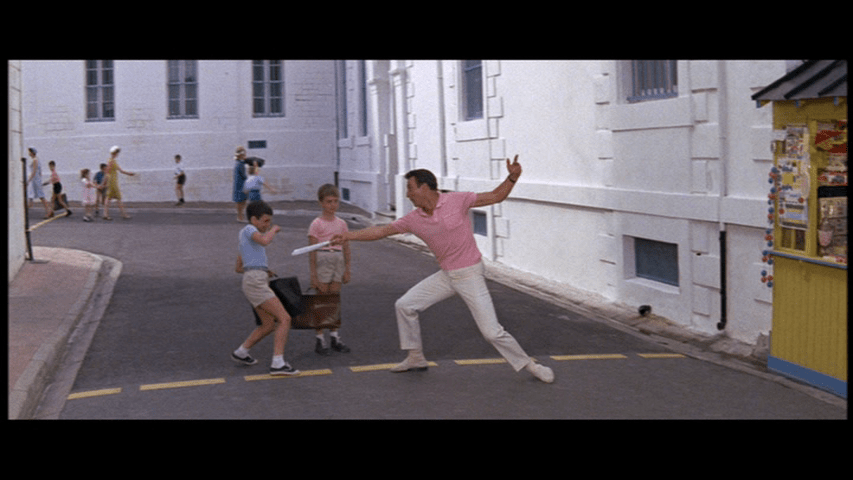 Gene Kelly "fencing" with two children