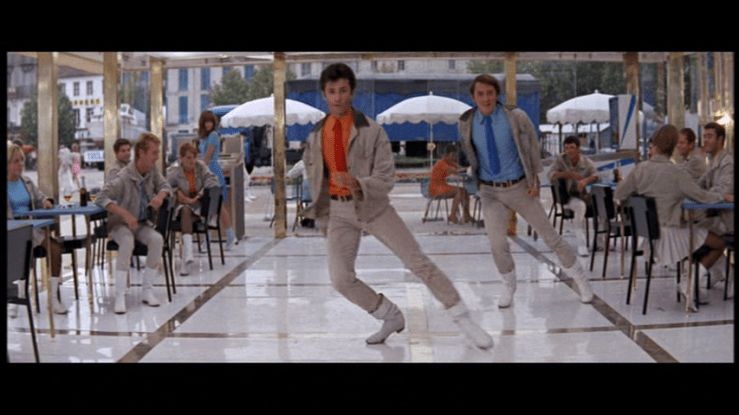 George Chakiris and Grover Dale sliding first stage left . . .