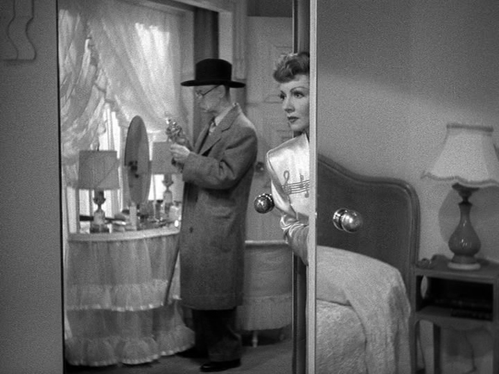 An old man sniffs Jerry's perfume as she looks one