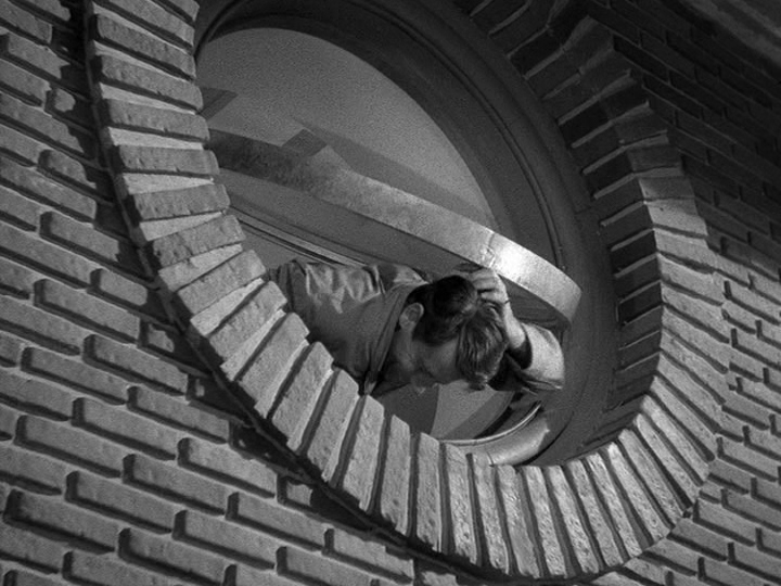 Tom Jeffers bumps his head on a round pivot window