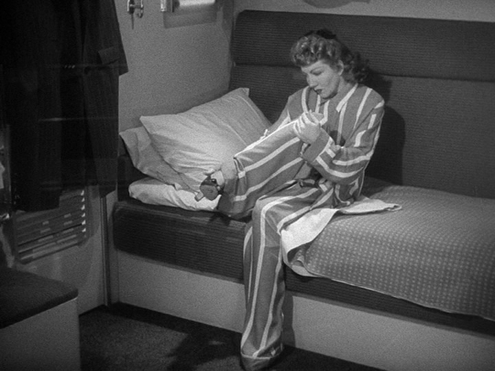 Medium shot of Gerry in borrowed pajamas