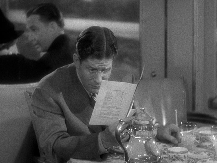 J.D. Hackensacker III takes notes on a menu