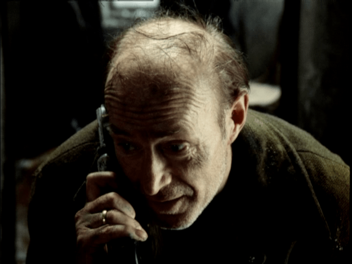 Professor talking on the phone outside the Room