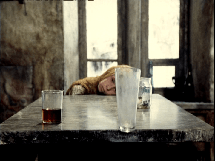 The third glass topples off the edge of the table