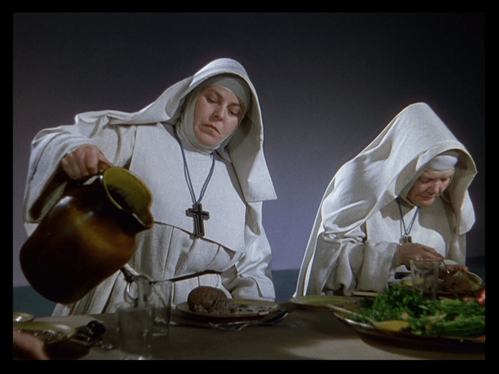 Medium shot of Sister Briony easily lifting a heavy jug