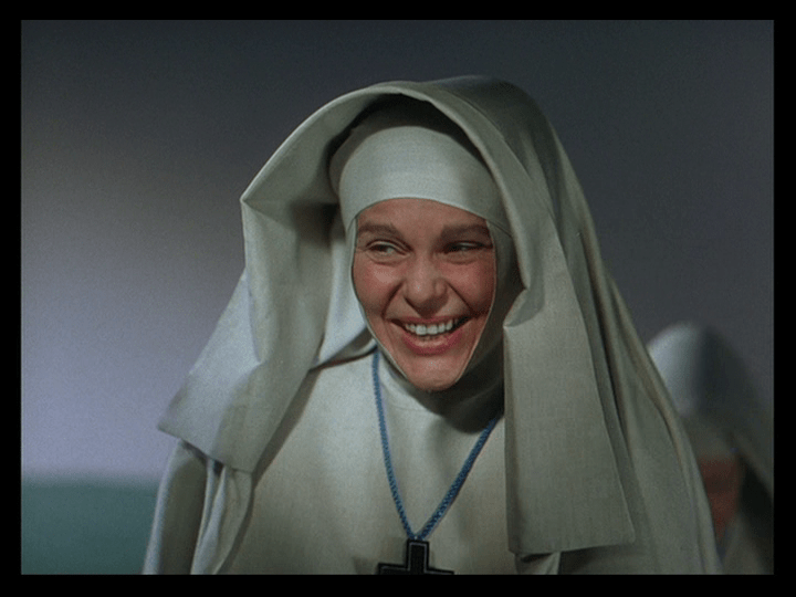 Medium shot of Sister Honey smiling