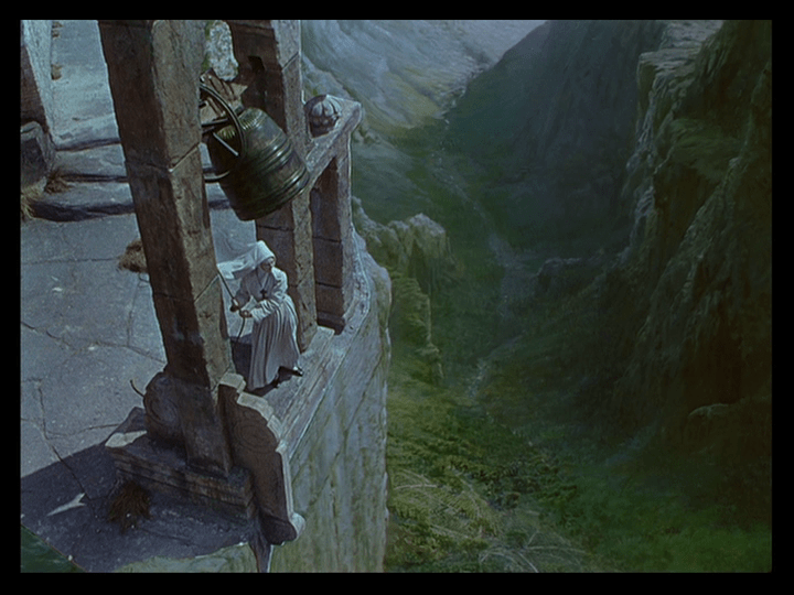 Sister Ruth rings the bell of Saint Faith, which is situated on the edge of towering cliffs