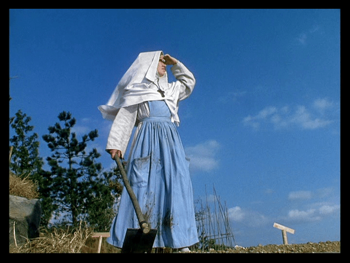 A distracted Sister Philippa stares off into space