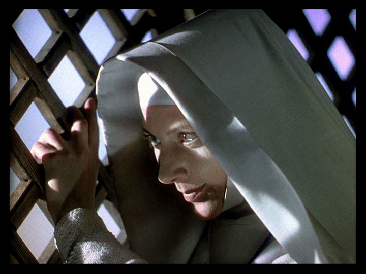 Sister Ruth looks out a window