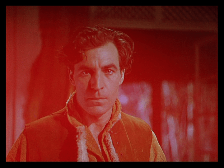 Red-tinted POV shot of Mr. Dean from Sister Ruth's perspective