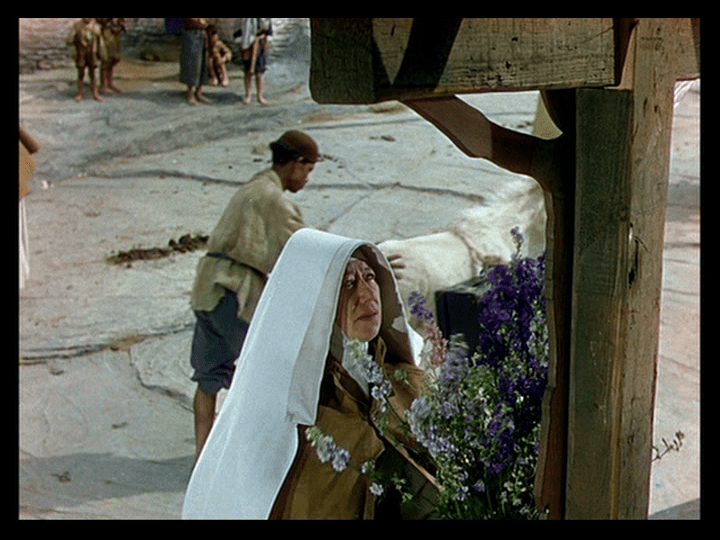 Sister Philippa places flowers on Sister Ruth's grave